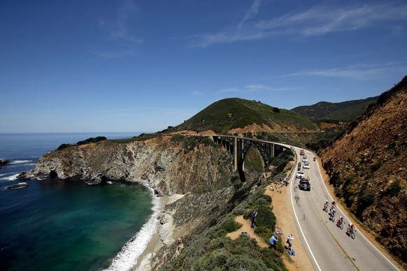 BIG SUR, CA - MAY 14: Will Routley of Canada riding for Optum p/b Kelly Benefit Strategies leads a break away group along California Highway 1 just past the Bixby Bridge during stage four of the 2014  ...
