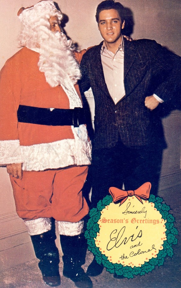 Elvis Presley and Colonel Tom Parker, posing for a Christmas card, circa 1965 File Reference 34145-833THA PUBLICATIONxINxGERxSUIxAUTxONLY Copyright: xCinemaxLegacyxCollection/ThexHollywoodxArchivex 34 ...