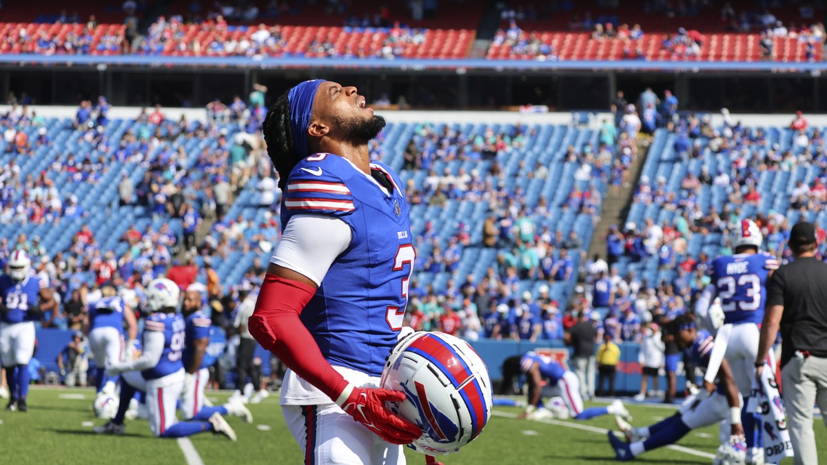 Buffalo Bills safety Damar Hamlin removes his helmet while warming up prior to an NFL football game against the Miami Dolphins, Sunday, Oct. 1, 2023, in Orchard Park, N.Y. (AP Photo/Jeffrey T. Barnes) ...
