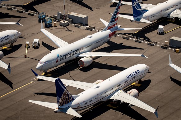 epa08968609 (FILE) - Boeing 737 Max 8 aircraft owned by American Airlines and United Airlines sit parked at Boeing Field in Seattle, Washington, USA, 21 July 2019 (reissued 27 January 2021). Media rep ...