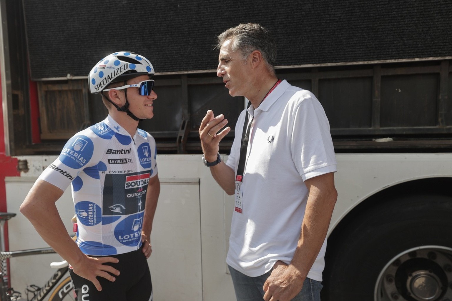 epa10852515 Belgian rider Remco Evenepoel of Soudal Quick Step chats with Spanish former cyclist Miguel Indurain (R) before the fifteenth stage of the Vuelta a Espana, a 158.5 km cycling race from Pam ...