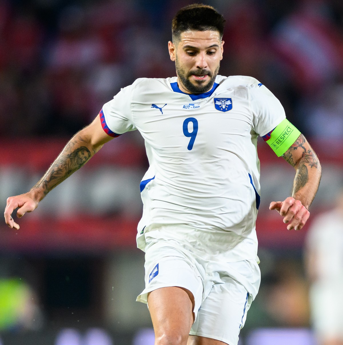 epa11390257 Aleksandar Mitrovic of Serbia (L) in action with Leopold Querfeld of Austria (R) during the friendly international soccer match between Austria and Serbia in Vienna, Austria, 04 June 2024. ...