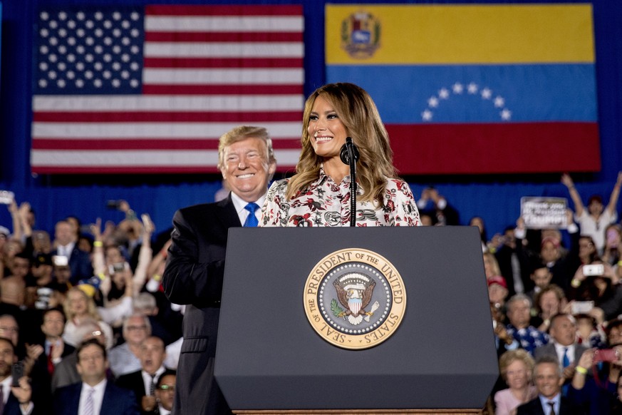 First lady Melania Trump, accompanied by President Donald Trump, smiles as she speaks in front of a Venezuelan American community at Florida Ocean Bank Convocation Center at Florida International Univ ...