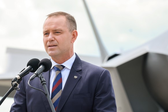 epa13032284 Polish President Karol Nawrocki speaks during the ceremony of F-35 fighter jets officially join the Polish Armed Forces at 332nd Tactical Air Base in Lask, central Poland, 12 June 2026. Th ...