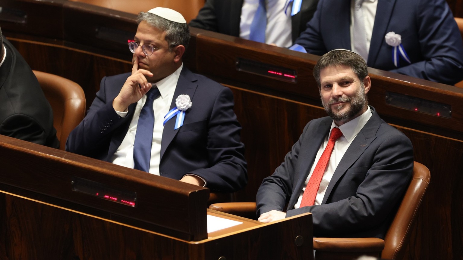 epa12168028 (FILE) - Israeli right wing Knesset member Itamar ben Gvir (L) and Bezalel Smotrich (R) during the swearing inceremony of the new Israeli Parliament, the 25th Knesset in Jerusalem, 15 Nove ...