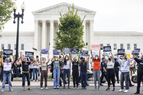 epa09505876 Pro-choice activists gather outside the US Supreme Court on the the first day of the high court&#039;s new term in Washington, DC, USA, 04 October 2021. The court&#039;s docket for their u ...