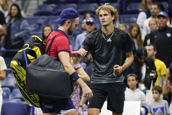 Germany&#039;s Alexander Zverev, right, consoles Jack Sock as Sock leaves the courth after their match during the third round of the US Open tennis championships, Saturday, Sept. 4, 2021, in New York. ...