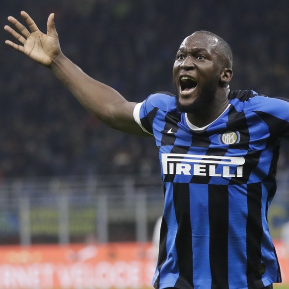 Inter Milan's Romelu Lukaku celebrates after his teammate Roberto Gagliardini scored his side's second goal during a Serie A soccer match between Inter Milan and Genoa, at the San Siro stadi ...