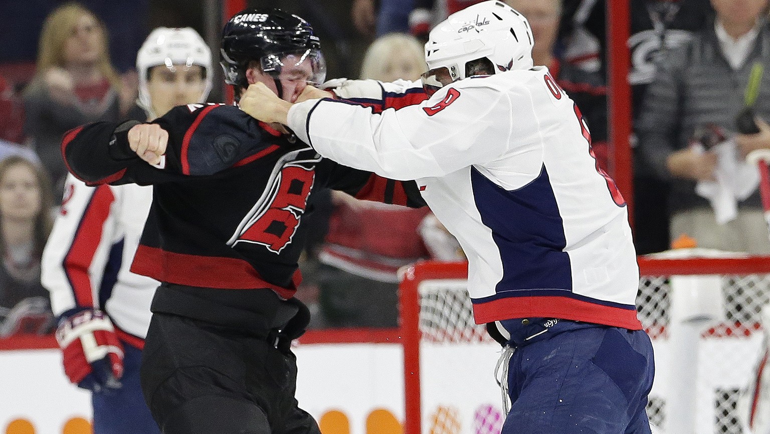 Washington Capitals&#039; Alex Ovechkin, right, of Russia, punches Carolina Hurricanes&#039; Andrei Svechnikov, also of Russia, during the first period of Game 3 of an NHL hockey first-round playoff s ...