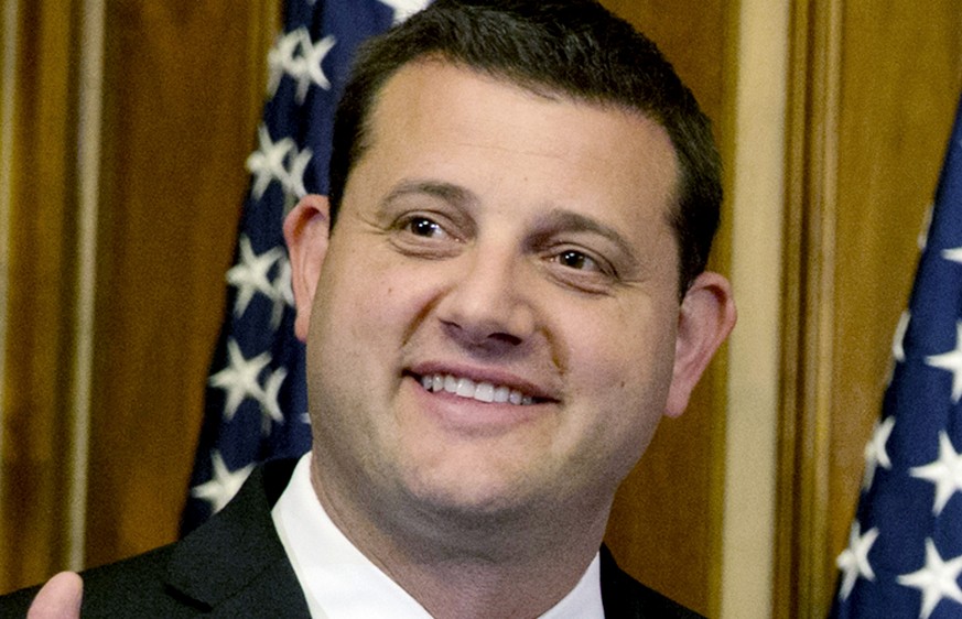 FILE - U.S. Rep. David Valadao, R-Calif., poses during a ceremonial re-enactment of his swearing-in ceremony in the Rayburn Room on Capitol Hill in Washington on Jan. 6, 2015. Valadao is being challen ...