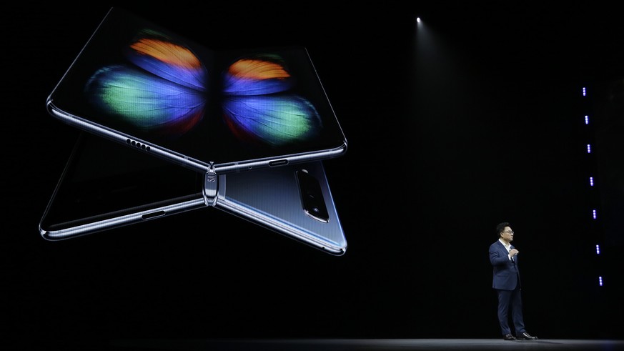 DJ Koh, Samsung President and CEO of IT and Mobile Communications, talks about the new Samsung Galaxy Fold smartphone during an event Wednesday, Feb. 20, 2019, in San Francisco. (AP Photo/Eric Risberg ...