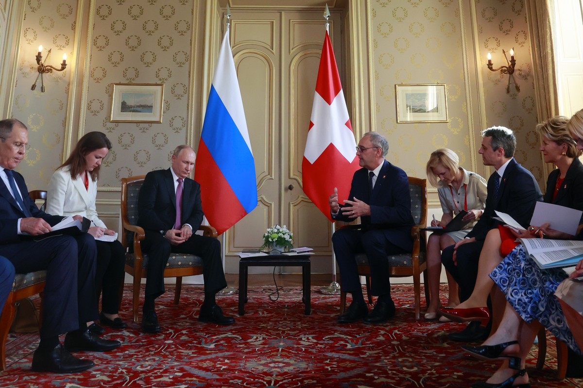 Swiss President Guy Parmelin, center right, and Swiss Foreign Minister Ignazio Cassis, right, attend a bilateral meeting with Russia's President Vladimir Putin, center left, and Russia's For ...