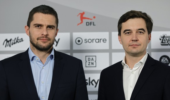 epa11022917 Managing Directors Marc Lenz (L) and Steffen Merkel (R) pose during a press conference following the General Assembly of Members of the German Football League (DFL) in Frankfurt Main, Germ ...