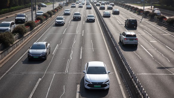 epa11720219 A BYD Han electric car drives on a highway in Beijing, China, 14 November 2024. According to the Chinese Association of Automobile Manufacturers (CAAM), China&#039;s annual output of new e ...