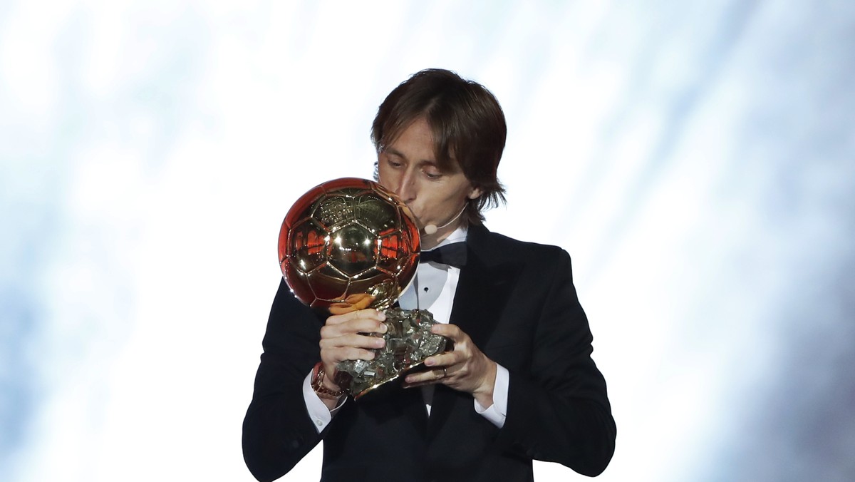 Real Madrid's Luka Modric celebrates with the Ballon d'Or award during the Golden Ball award ceremony at the Grand Palais in Paris, France, Monday, Dec. 3, 2018. Awarded every year by France ...