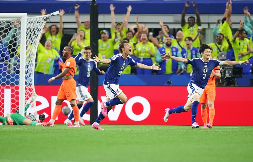 Japan's Koki Ogawa (19) and Shogo Taniguchi (3) celebrate their side's second goal against the Netherlands during a World Cup Group F soccer match in Arlington, Texas, near Dallas, Sunday, J ...