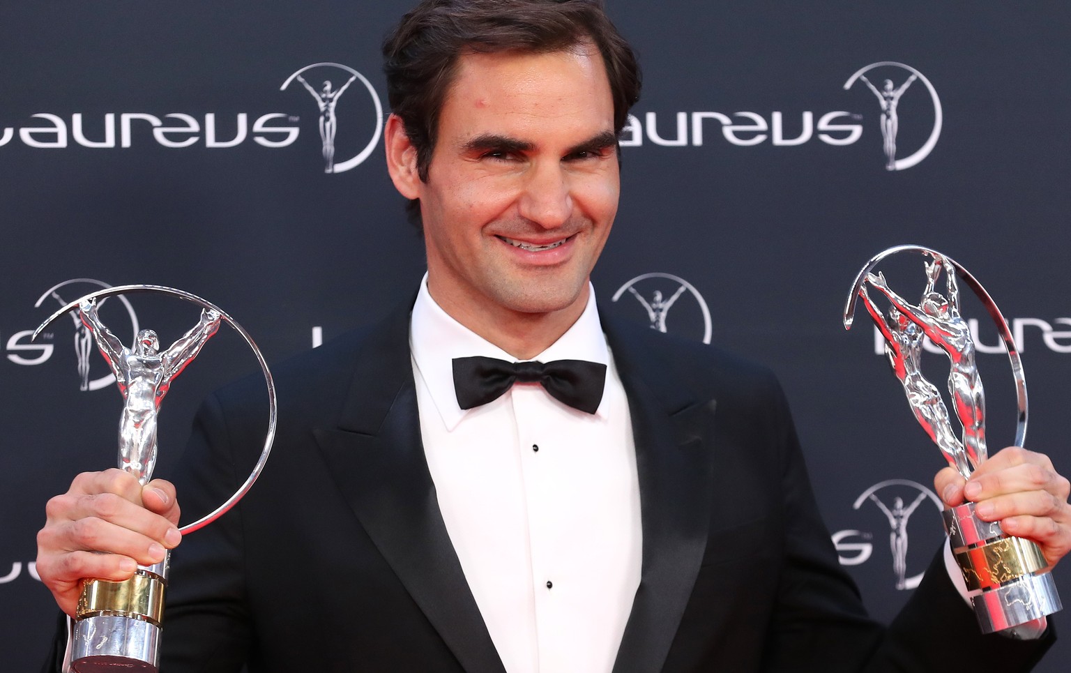 epa06569203 Swiss tennis player Roger Federer poses with the &#039;Sportsman Award&#039; and &#039;Comeback Awards&#039; at the 2018 Laureus World Sports Awards in Monaco, 27 February 2018. The annual ...