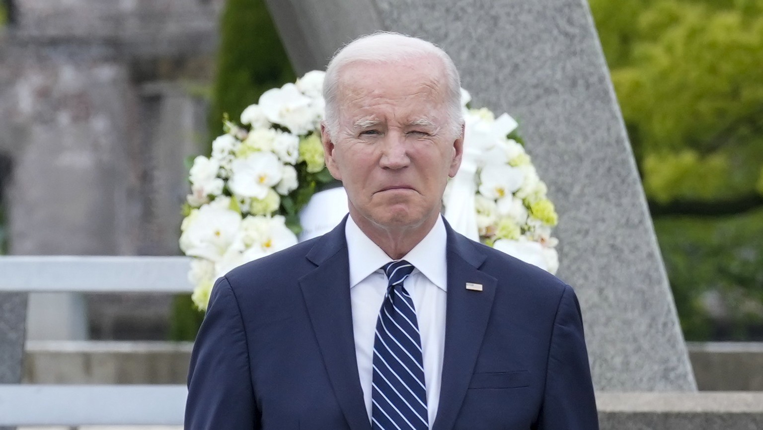 Prime Minister Fumio Kishida of Japan and with U.S. President Joe Biden, right, react after laying a wreath at the Hiroshima Peace Memorial Park in Hiroshima, Japan, Friday, May 19, 2023, during the G ...