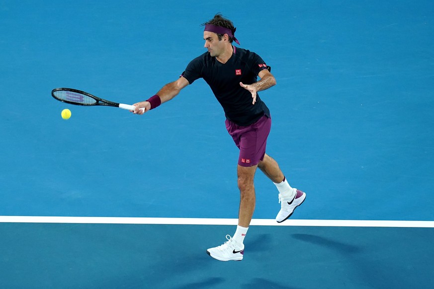 epa08143546 Roger Federer of Switzerland in action against Steve Johnson of the USA during a first round match on day one of the Australian Open tennis tournament at Melbourne Park in Melbourne, Austr ...