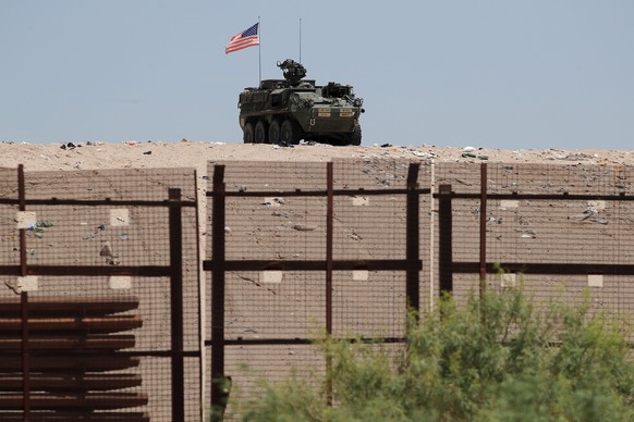 KEYPIX - epa12248043 An armored combat vehicle with the US flag behind a metal fence in Ciudad Juarez, Chihuahua, Mexico, 18 July 2025 (issued 19 July 2025). Using taller and more resistant steel stru ...