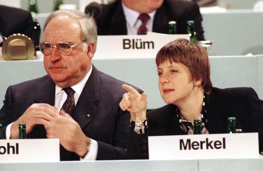 FILE - This undated file photo shows then German Women and Youth Minister Angela Merkel, right, beside then Chancellor Helmut Kohl. Merkel is favored to win a fourth term in Germany&#039;s Sept. 24, 2 ...