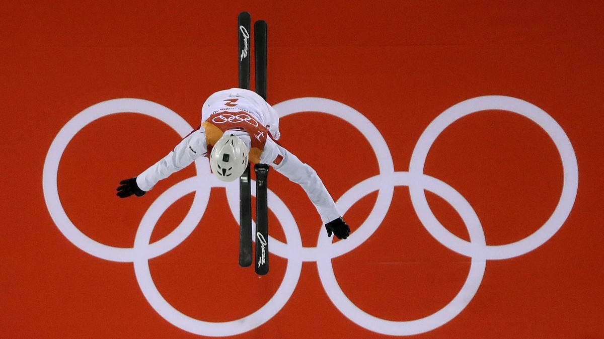 Jia Zongyang, of China, jumps during the men's aerial final at Phoenix Snow Park at the 2018 Winter Olympics in Pyeongchang, South Korea, Sunday, Feb. 18, 2018. (AP Photo/Gregory Bull)