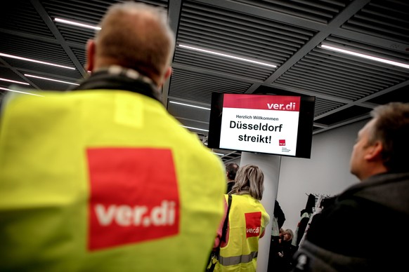 epa07272566 A display reading &#039;Duesseldorf on strike!&#039; as members of the United Services Trade Union (ver.di) take part in a warning strike by ground security inspection staff at Duesseldorf ...