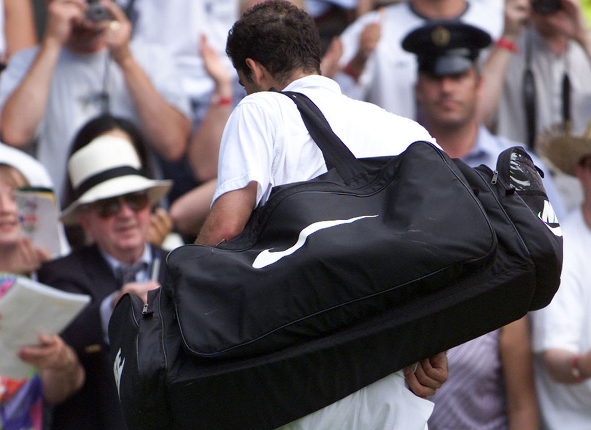 Pete Sampras leaves Wimbledon's Centre Court, Monday July 2, 2001, following his defeat by Roger Federer of Switzerland. Federer, defeated Sampras, the defending champion, 7-6 (9-7), 5-7, 6-4, 6- ...