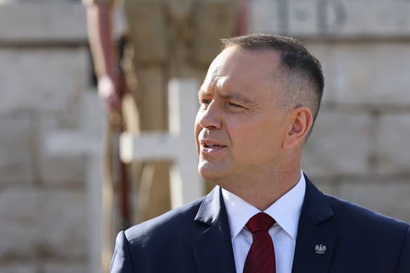 epa12972355 Polish President Karol Nawrocki takes part in the Roll Call of the Fallen at the Polish War Cemetery in Monte Cassino, Italy, 18 May 2026. The Polish presidential couple is participating i ...