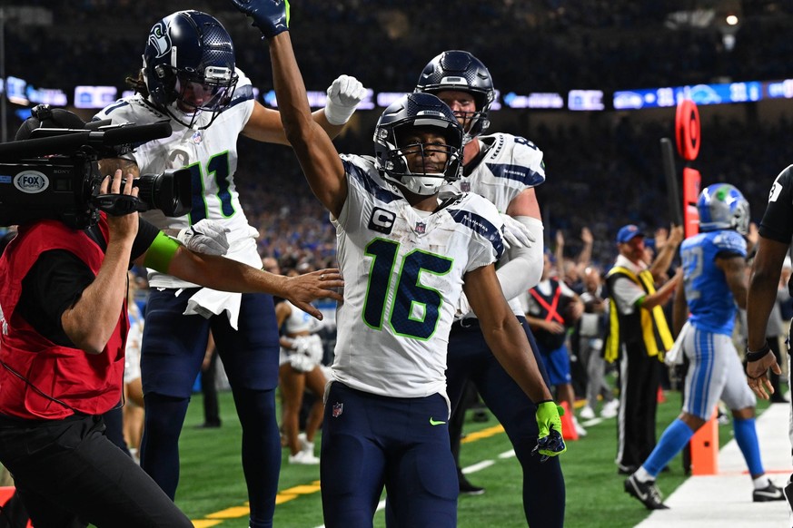 DETROIT, MI - SEPTEMBER 17: Seattle Seahawks wide receiver Tyler Lockett 16 celebrates his game winning touchdown reception in overtime to beat the Detroit Lions 38-31 in the game on Sunday September  ...