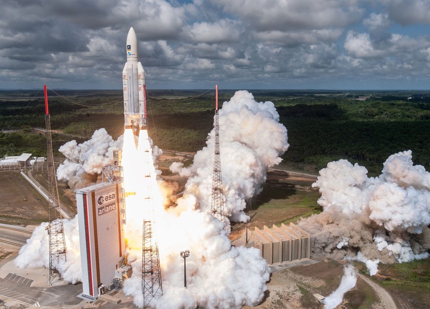 epa05635676 A handout photograph made available European Space Agency (ESA) by showing Ariane 5 lifting off on flight VA233, from Europe&#039;s Spaceport in Kourou, French Guiana, on 17 November 2016. ...