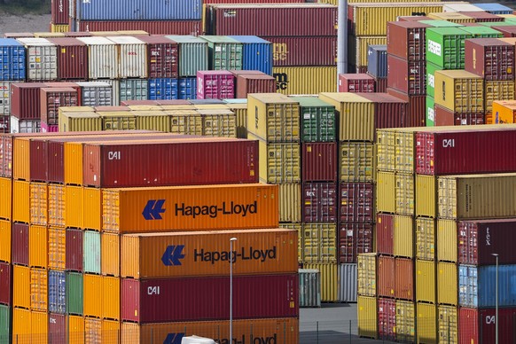 epa12022794 Shipping containers are stacked at the Duisport in Duisburg, Germany, 10 April 2025. US President Trump on 09 April has paused for 90 days the implementation of higher tariffs announced on ...