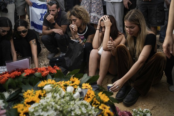 Mourners attend the funeral of Shani Louk in Srigim, Israel, on Sunday, May 19, 2024. Louk, a 22-year-old German-Israeli, was killed while fleeing a music festival during Hamas&#039; Oct. 7 attack and ...