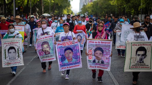 epa09978909 Hundreds of people protest the disappearance of 43 Ayotzinapa students in Mexico City, Mexico, 26 May 2022. The Attorney General's Office (FGR) of Mexico reported that it extradited t ...