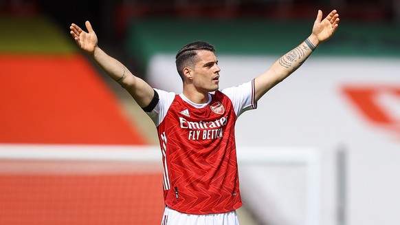 epa09143485 Granit Xhaka of Arsenal reacts during the English Premier League soccer match between Arsenal FC and Fulham FC in London, Britain, 18 April 2021. EPA/Julian Finney / POOL EDITORIAL USE ONL ...