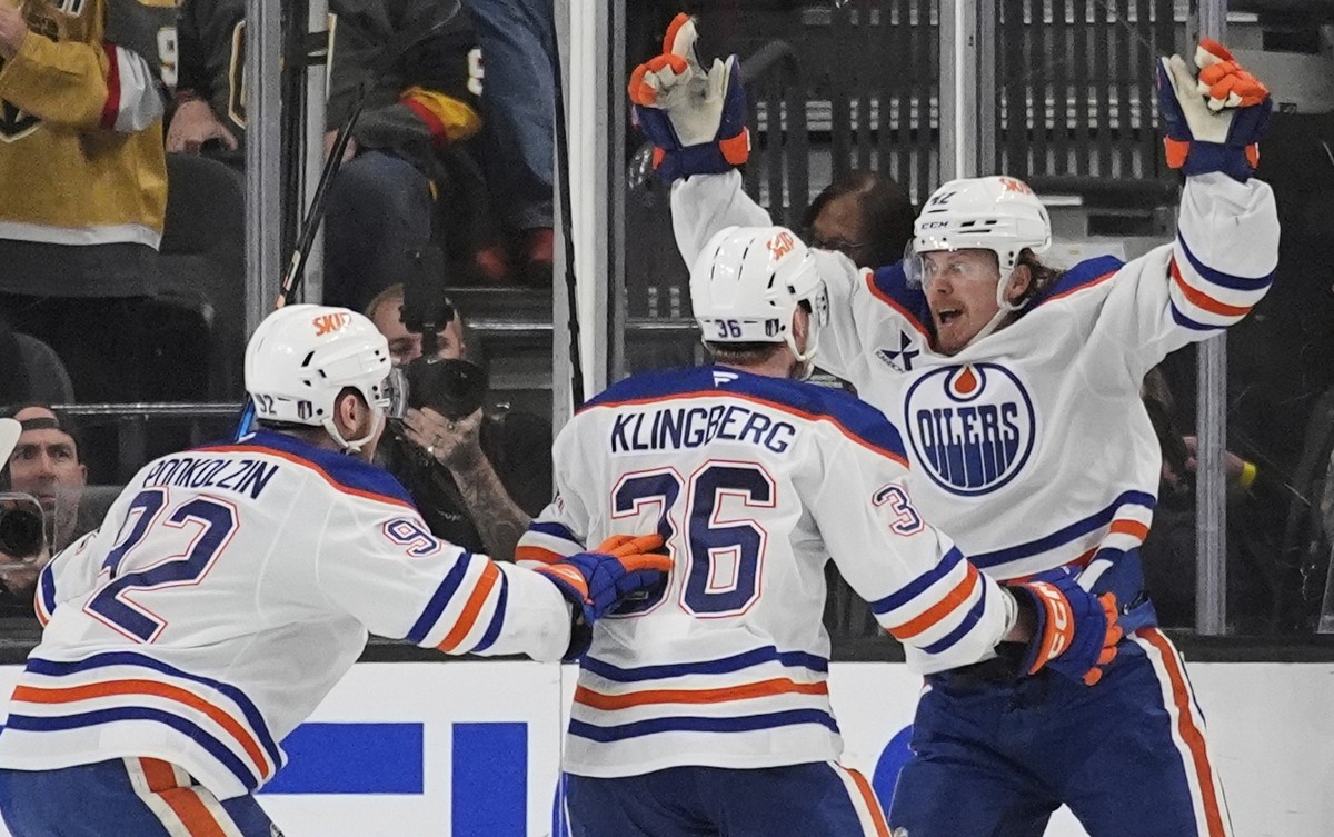 Edmonton Oilers right wing Kasperi Kapanen, right, celebrates with teammates after scoring against the Vegas Golden Knights during overtime of Game 5 of a second-round NHL hockey playoff series Wednes ...