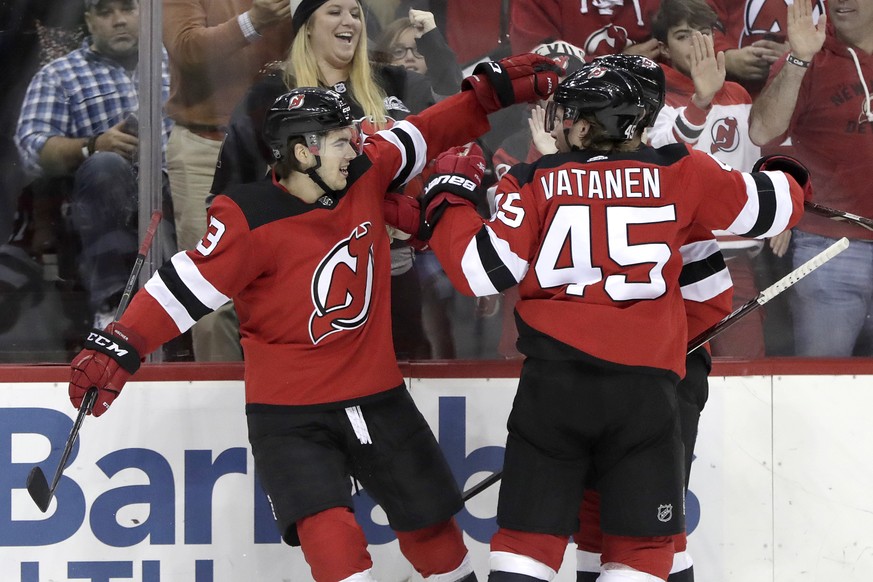 New Jersey Devils center Nico Hischier, left, of Switzerland, celebrates his goal with teammates during the second period of an NHL hockey game against the Nashville Predators, Thursday, Oct. 25, 2018 ...