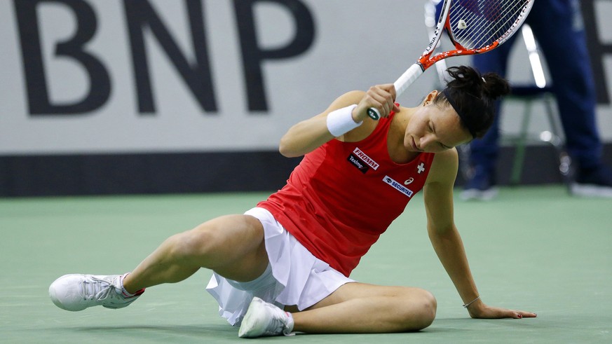 epa05923313 Viktorija Golubic of Switzerland reacts during her singles match against Aryna Sabalenka of Belarus at the Fed Cup 2017 World Group semi final tie between Belarus and Switzerland in Minsk, ...