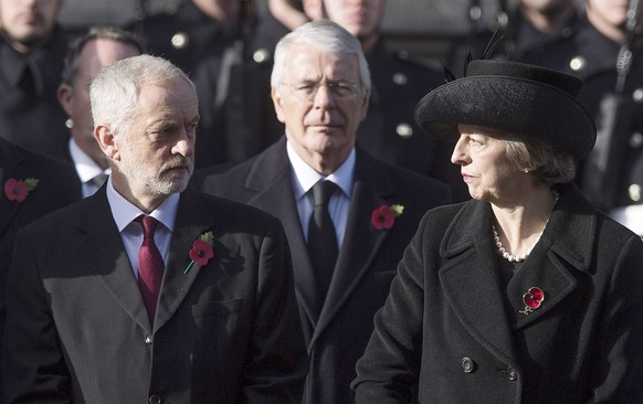 epa05629642 British Prime Minister Theresa May (R) and Jeremy Corbyn Leader of the Labour Party (L) and former British Prime Minister Sir John Major (C) during the Remembrance Sunday ceremony at the C ...