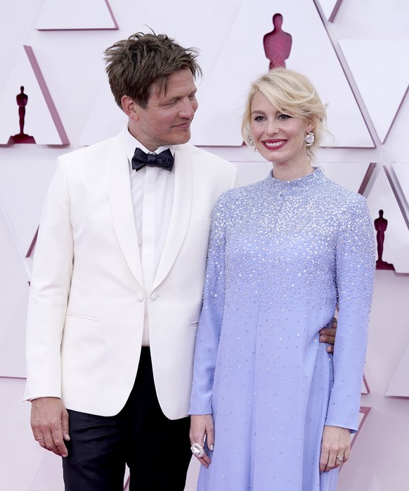 epa09159781 Thomas Vinterberg (L) and Helene Reingaard Neumann arrive for the 93rd annual Academy Awards ceremony at Union Station in Los Angeles, California, USA, 25 April 2021. The Oscars are presen ...