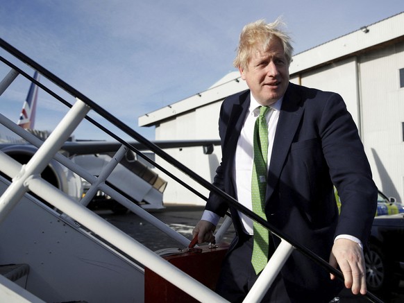 British Prime Minister Boris Johnson boards an aircraft on his way to Kyiv, Ukraine, in London Tuesday Feb. 1, 2022 as he holds crisis talks with Ukrainian president Volodymyr Zelensky amid rising ten ...