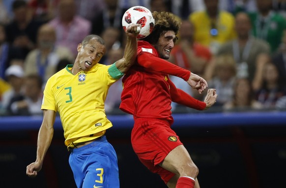 Brazil&#039;s Miranda, left, and Belgium&#039;s Marouane Fellaini go for a header during the quarterfinal match between Brazil and Belgium at the 2018 soccer World Cup in the Kazan Arena, in Kazan, Ru ...