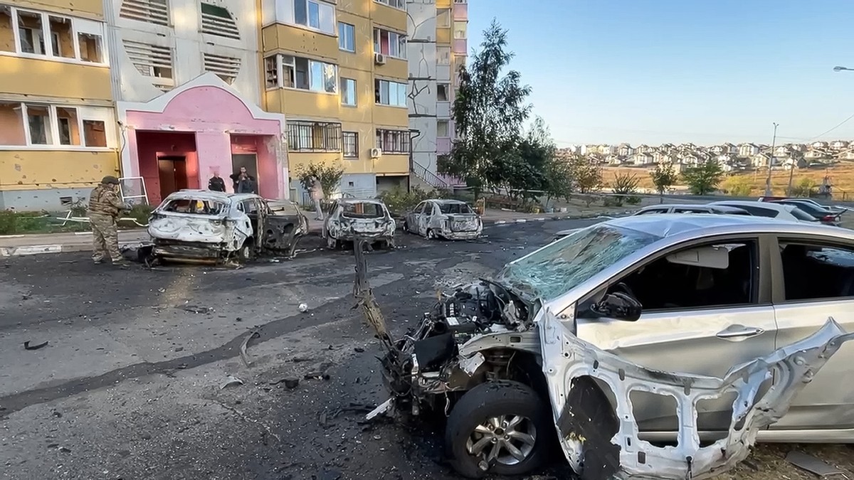 This photo released by Belgorod regional governor Vyacheslav Gladkov's Telegram channel on Monday, Sept. 16, 2024, shows burnt cars in the courtyard of an apartment building after a missile attac ...
