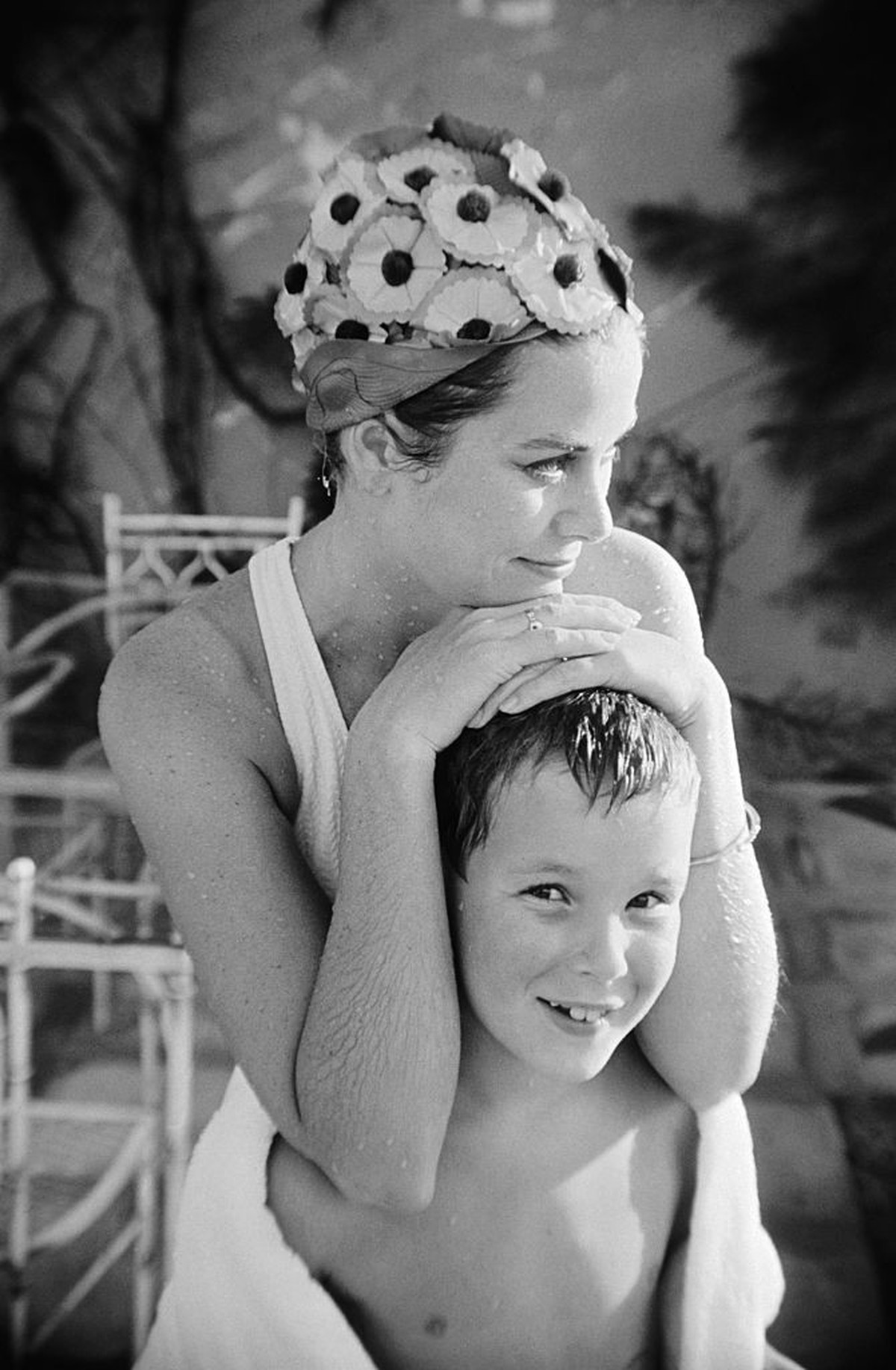 (Original Caption) On Vacation. Montego Bay, Jamaica: Princess Grace of Monaco is the picture of contentment as she relaxes at a poolside with her nine-year old son Prince Albert. This mother and son  ...