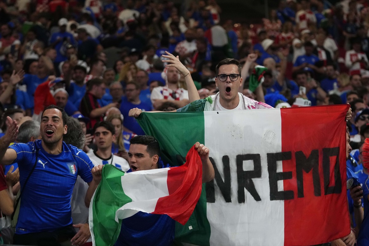 Italian fans cheer their teams during a Group B match between Croatia and Italy at the Euro 2024 soccer tournament in Leipzig, Germany, Monday, June 24, 2024. (AP Photo/Petr David Josek)