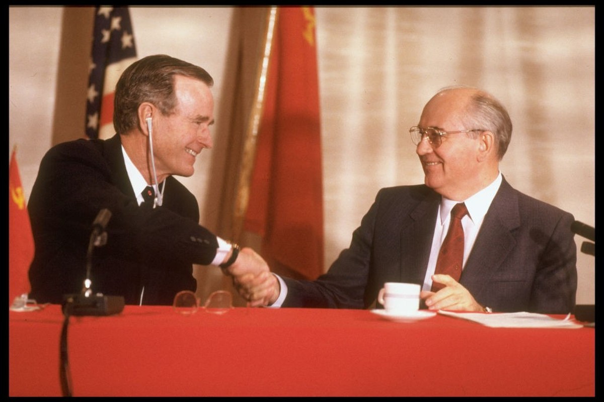 Pres. Bush (R) &amp; Soviet Pres. Gorbachev shaking hands, all smiles, holding summit press conf. (Photo by Dirck Halstead/Getty Images)