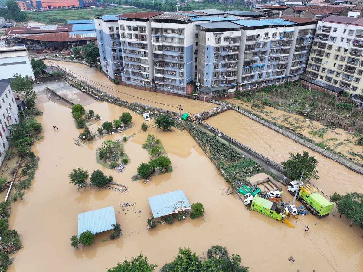 epa11472805 An aerial drone photo taken on July 11, 2024 shows a river after heavy rain in Chengxi Town, Dianjiang County, China, 11 July 2024. Torrential rains have recently hit Zhongxian County in C ...