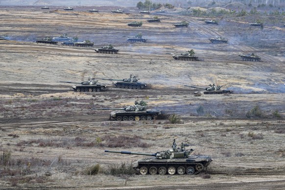 Tanks move during the Union Courage-2022 Russia-Belarus military drills at the Obuz-Lesnovsky training ground in Belarus, Saturday, Feb. 19, 2022. Russia has deployed troops to its ally Belarus for sw ...