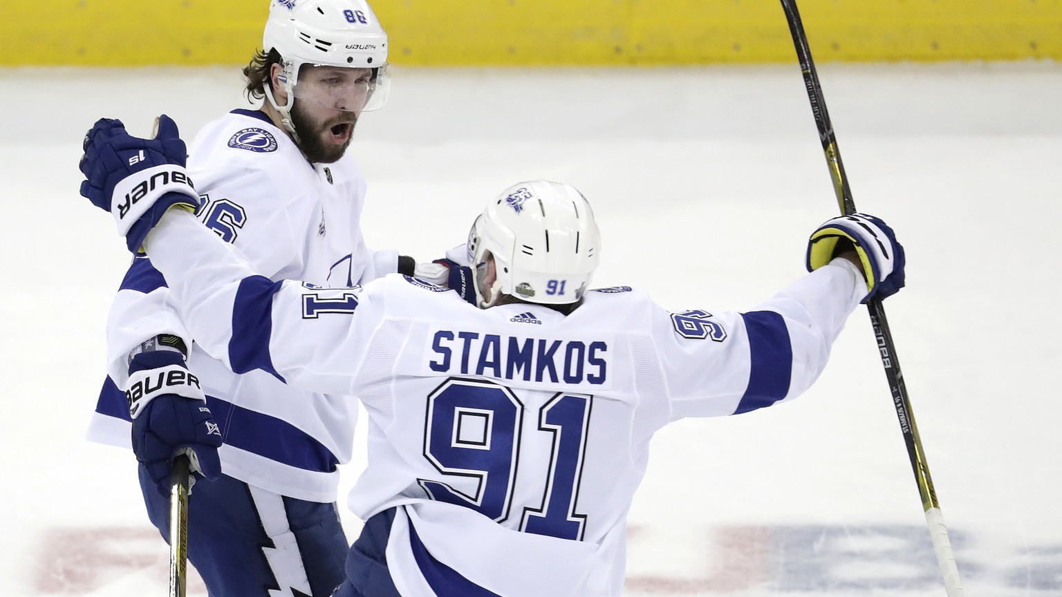 Tampa Bay Lightning right wing Nikita Kucherov, left, of Russia, celebrates his third-period goal with Steven Stamkos (91) during Game 4 of the team&#039;s NHL first-round hockey playoff series agains ...
