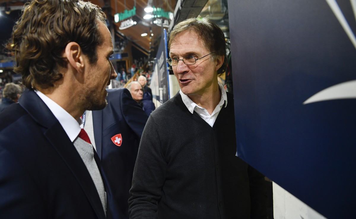 Team Suisse head coach Patrick Fischer, left, and Davos' head coach Arno del Curto after the game between Team Suisse and HC Davos at the 91th Spengler Cup ice hockey tournament in Davos, Switzer ...